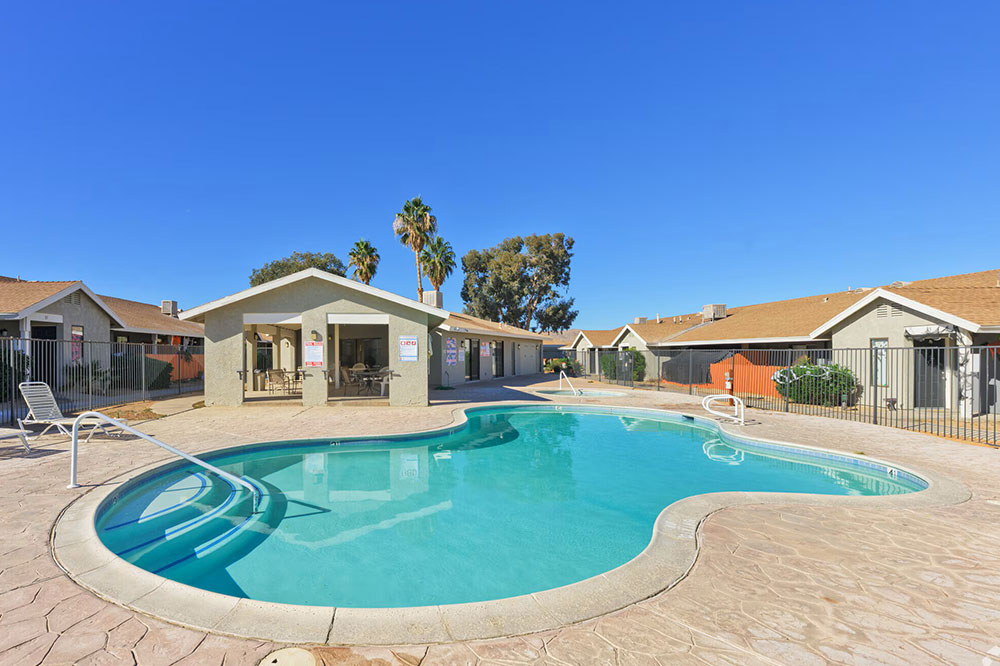 This image displays swimming pool photo of Quail Springs Village Apartments