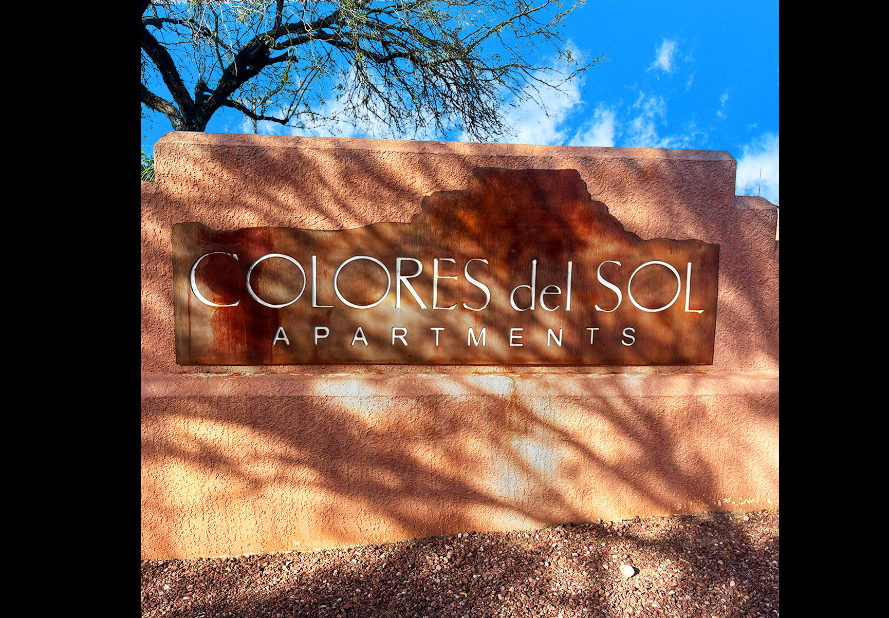 This image displays entrance marker photo of Quail Springs Village Joshua Trees