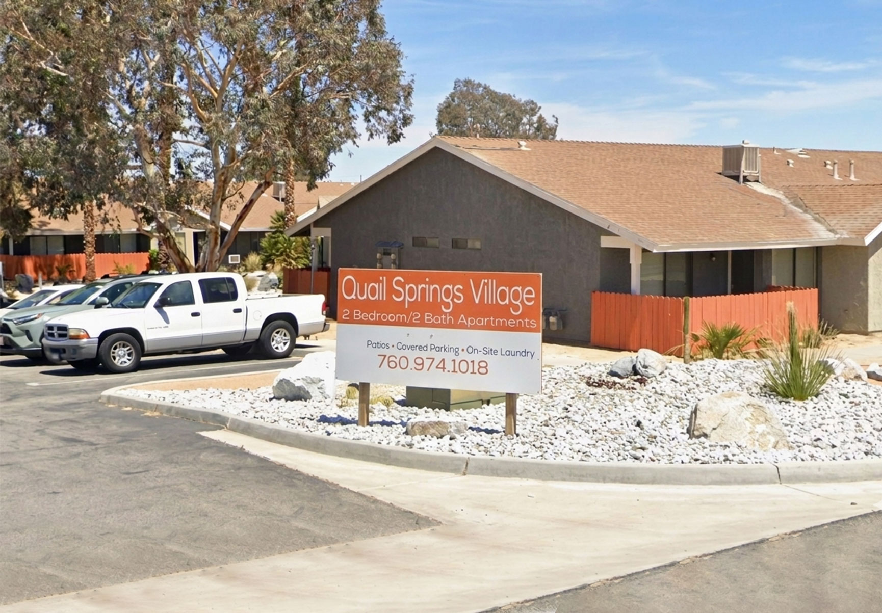 This image displays entrance marker photo of Quail Springs Village Joshua Trees
