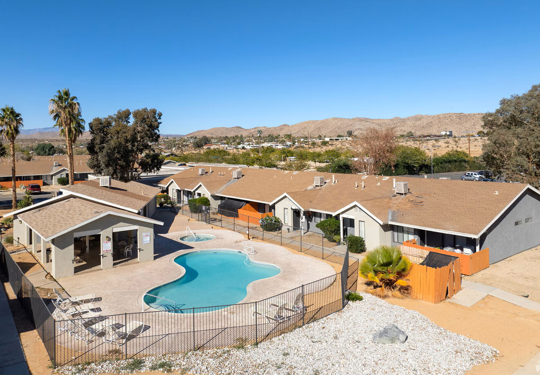 This image displays swimming pool photo of Quail Springs Village Apartments